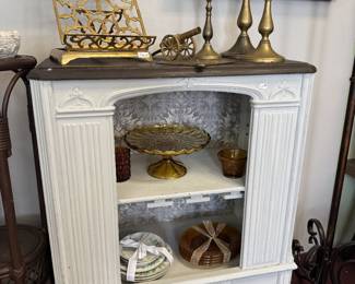 brass candlesticks, brass book holder, cake plate, gold tone mirror, vintage repurposed radio cabinet