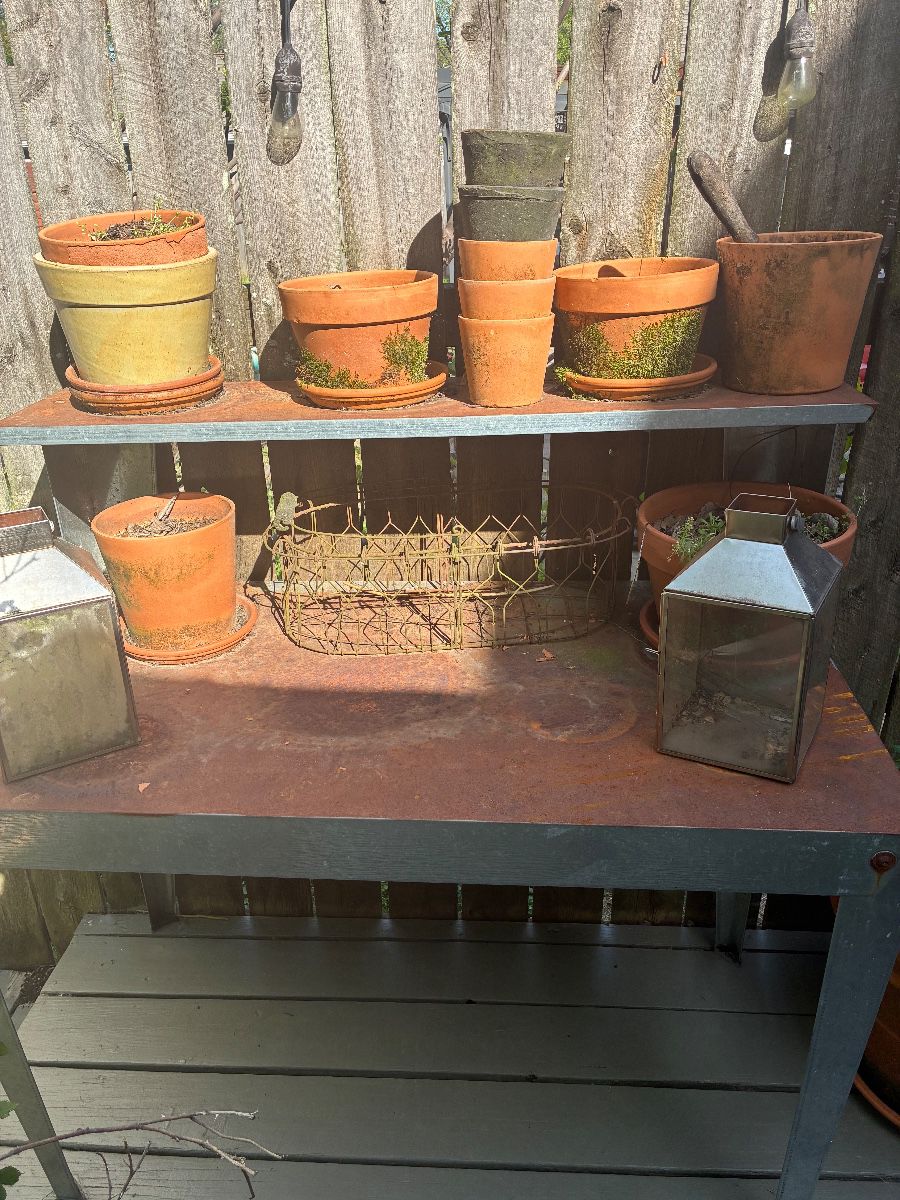 potting bench and various pots and planters