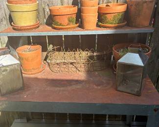 potting bench and various pots and planters