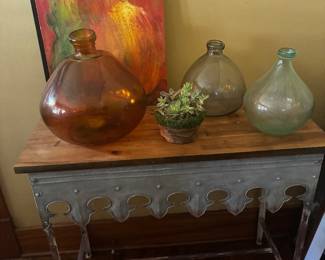 artwork, glass vessels and galvanized table