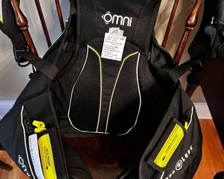 #208	New with Tage/Instrument Book Aqua Lung OMNI BCD (Buroyancy Control Devide) Features Inter Changeable Components for the Back - Jacket Style Size LRG	 $250.00 