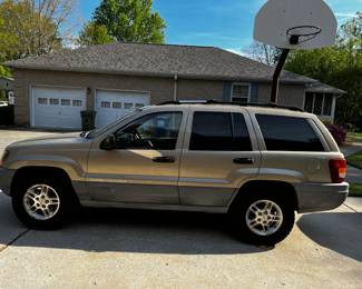 #240	Jeep Grand Cherokee  - 2000 Year Mileage 102590 in Running Condition, Leather Interior (as is drivers Seat  - Taking Bids through April 17th.