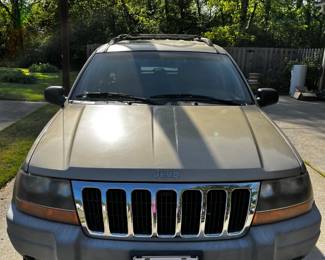 #240	Jeep Grand Cherokee  - 2000 Year Mileage 102590 in Running Condition, Leather Interior (as is drivers Seat  - Taking Bids through April 17th.