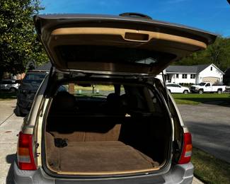 #240	Jeep Grand Cherokee  - 2000 Year Mileage 102590 in Running Condition, Leather Interior (as is drivers Seat  - Taking Bids through April 17th.