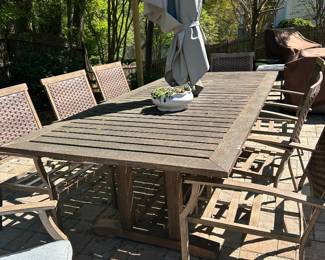 Patio table with umbrella, 8 chairs, gray cushions 