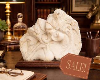 Elegant marble sculpture on wooden desk