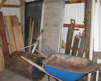 wheel borrow, steel lawn roller, old hand saws