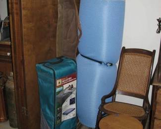 cot, mattress pad and a couple gun cases (THERE ARE NO GUNS)