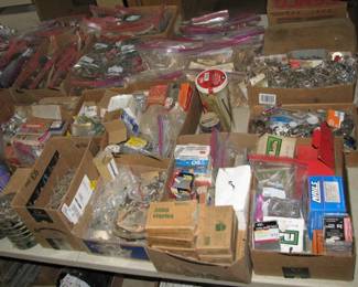 lots of hardware, screws, nails, drawer pulls and knobs, hinges and lots more