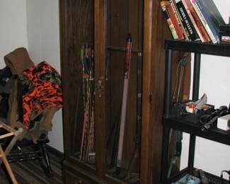 gun cabinet, bear bows on top and side