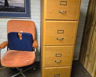 Orange desk chair, wood file cabinet