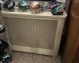 Many metal radiator covers for sale.