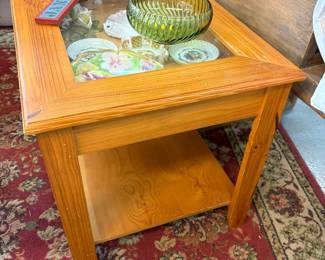 This is a lift top curio table