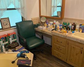 Personal care items and a stray chair