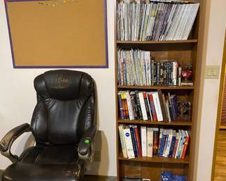 Comfy office chair and books and magazines and shelf