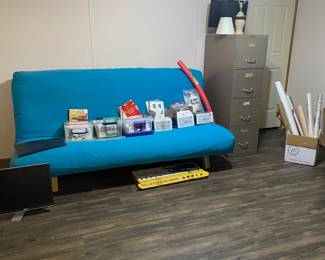 Futon, filing cabinet, wrapping paper