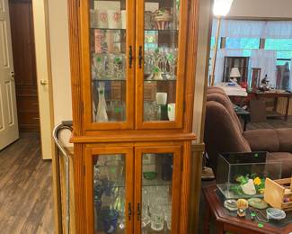 Curio cabinet filled with vintage glass