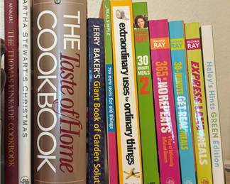 Lot 77: Antique Wood Silverware Storage Cabinet, Cookbooks, Metal Wine Rack, an Oval Christmas Plate, and Two Large Plastic Serving Trays