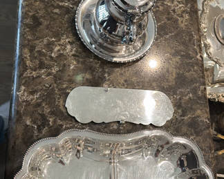 Lot 105: Silver-plated serving pieces including teapot, sugar dish, rectangular tray, and wire fruit basket