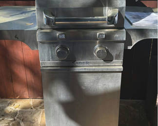 Lot 412: Saber gas grill with propane tank and cleaning supplies