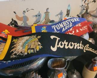 Vintage Banners Collectied in Travels. I see Toronto, Canada and Tomstone Arizona