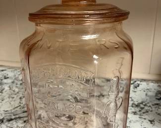 Planters Peanuts Mr. Peanut pink depression glass counter jar.