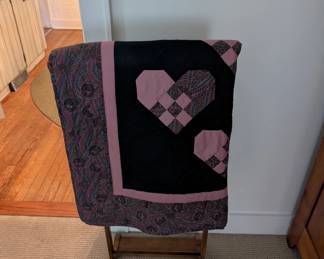 Vintage quilt on butler's rack