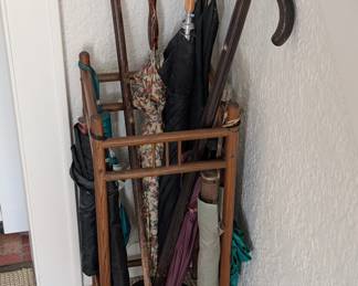 Vintage umbrella stand.  Some vintage umbrellas.  Some newer