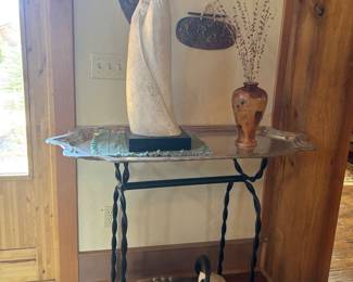 Glass top table with stone art statue