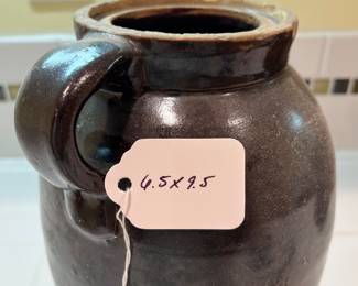 F57 - $40. Antique Stoneware Brown Jug. Measures 6.5" wide x 9.5" tall.