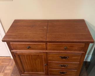 F5 - $150. Thomasville Buffet. Measures 40" wide x 18" deep x 37" tall. When the top flips open it is 80" wide.