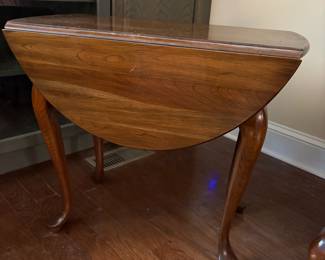 F16 - $65. Queen Ann Style Drop Leaf Side Table. Measures 32.5" x 28" deep x 24" tall. 15" wide with leaves down.