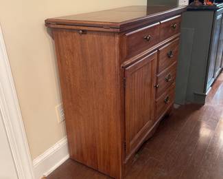 F5 - $150. Thomasville Buffet. Measures 40" wide x 18" deep x 37" tall. When the top flips open it is 80" wide.