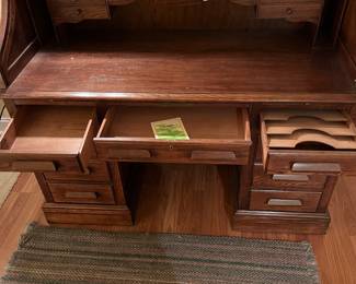 F62 - $125. Jasper Cabinet Roll Top Desk. Measures 55" x 26.75" x 46.5". ON A BASEMENT LEVEL - YOU WILL NEED HELP TO MOVE!