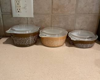 F72 - $75. Set of 3 Pyrex Bowls "Woodland" Pattern. With lids.