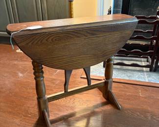 F12 - $45. Small Drop Leaf Side Table. Measures 27" x 23" x 22.25" tall.