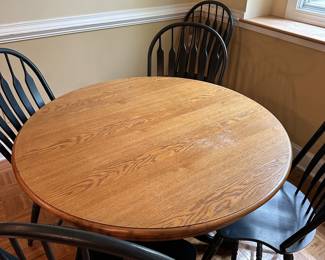 F51 - $150. Solid Wood Pedestal Table with 6 Chairs + 2 Leaves. Table top could use refinishing but it's solid! Some chairs have paint wear from use.