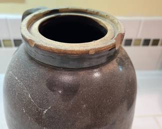 F57 - $40. Antique Stoneware Brown Jug. Measures 6.5" wide x 9.5" tall.