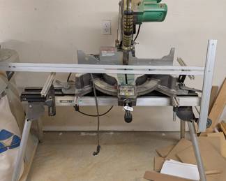 F96 - $250. Hitatchi Compound Miter Saw with Digital Display. Model C12LC Digital. On stand. NOT sliding.