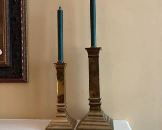 F27 - $35. Pair of *heavy* brass candlesticks. 10" & 12.25" tall.