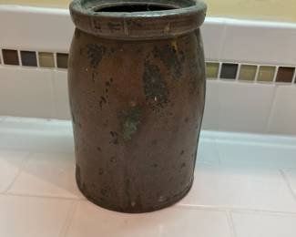 F56 - $60. Antique Canning Crock. Measures 5.25" x 7.5" tall.