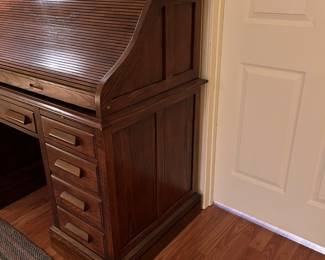 F62 - $125. Jasper Cabinet Roll Top Desk. Measures 55" x 26.75" x 46.5". ON A BASEMENT LEVEL - YOU WILL NEED HELP TO MOVE!