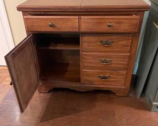 F5 - $150. Thomasville Buffet. Measures 40" wide x 18" deep x 37" tall. When the top flips open it is 80" wide.