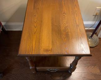 F6 - $40. Wooden Side Table with Single Drawer. Measures 21.5" x 28" x 22.75".