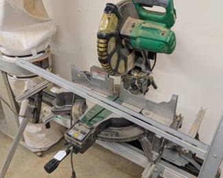 F96 - $250. Hitatchi Compound Miter Saw with Digital Display. Model C12LC Digital. On stand. NOT sliding.