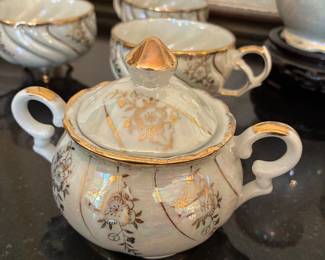 Retro antique iridescent Japanese footed tea cups, saucers, teapot, sugar pot, and creamer