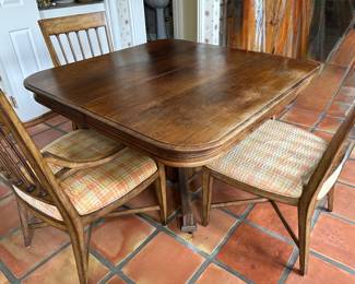 Antique walnut Table and four chairs, also has two leaves