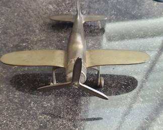 $5 brass plane