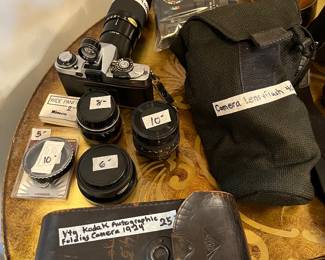 Assorted cameras, lenses, and cases… Minolta, Washica, Kodak