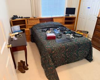 Bedroom headboard, phones, sideboard, cables, keyboard, watches, bed sheets, computer monitors